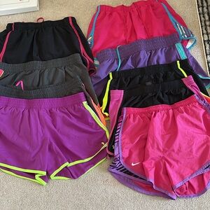 Women's gym shorts. 1 pair is North Face and Nike the others are under armour 9